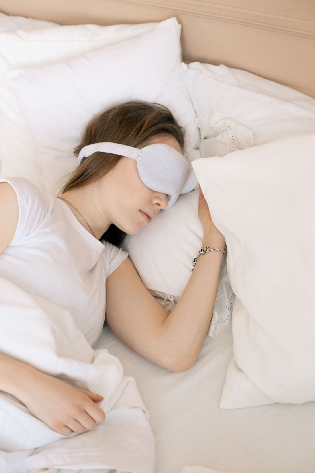 Woman sleeping comfortably with a sleep mask on