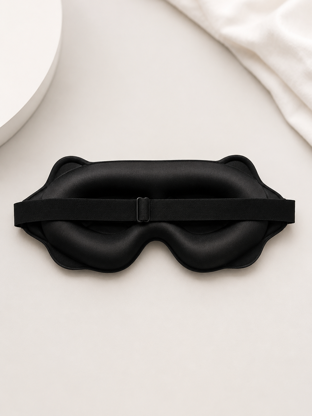 Blackout eye mask worn on face showing zero eye pressure fit