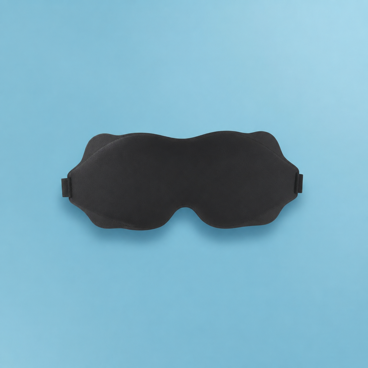 MigraineMend blackout eye mask close-up showing contoured light-blocking design